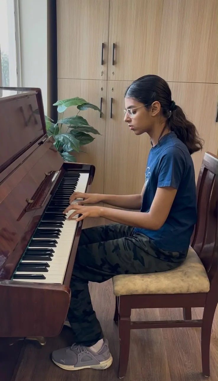 Student playing piano at Brij School of Music